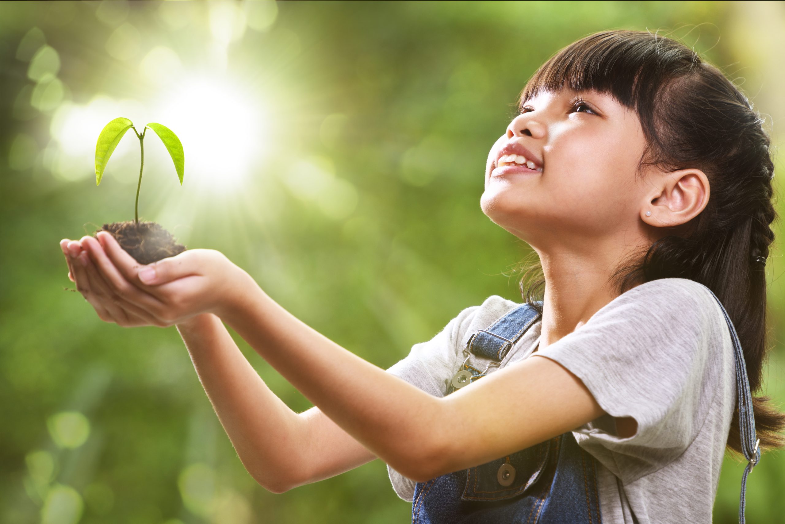 Child with plant in hand