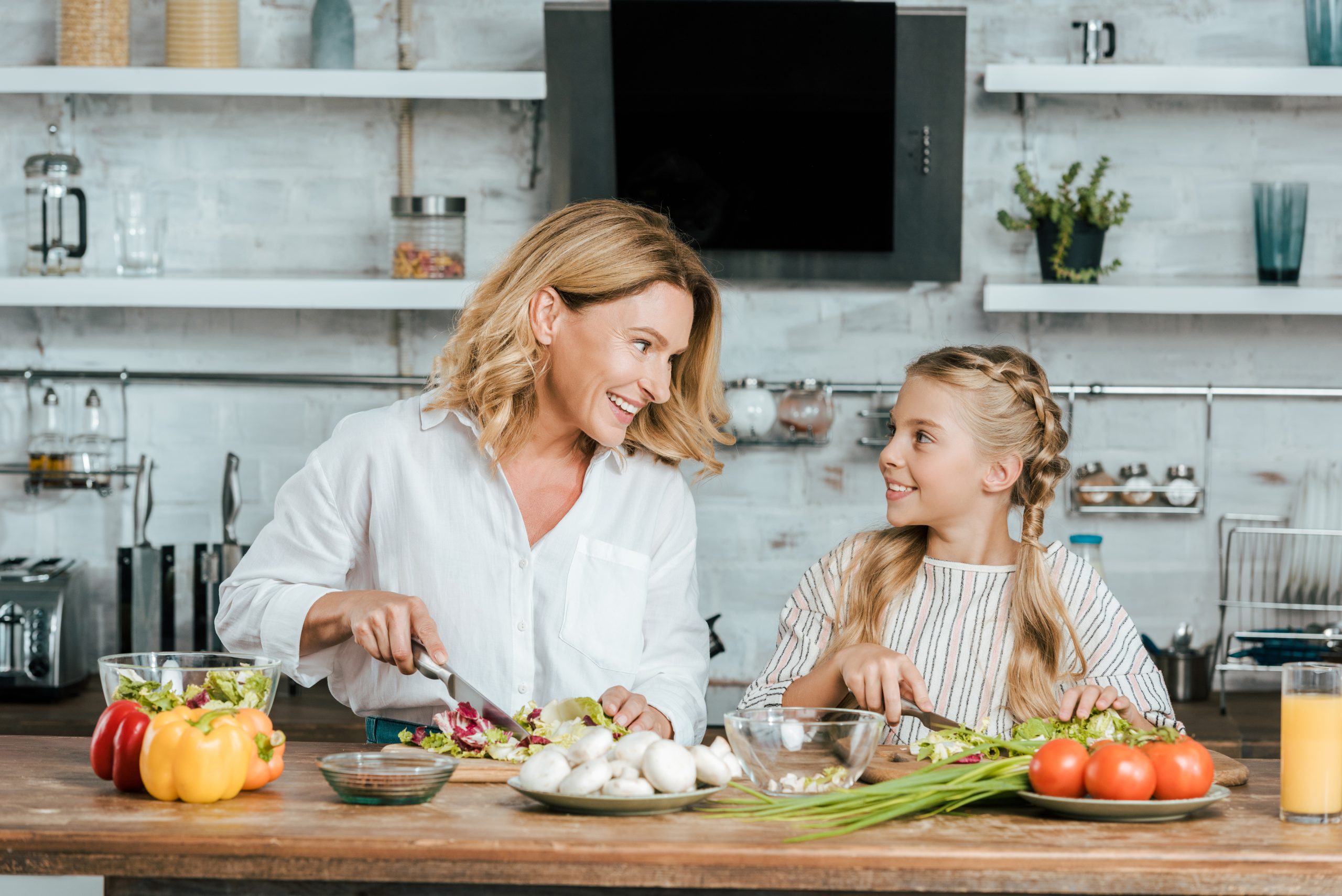 Mother daughter food prep side